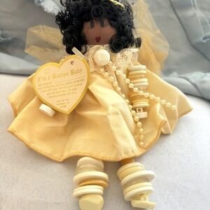 Yellow Button Baby Doll with Black Hair